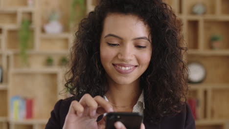 close up portrait of beautiful elegant hispanic business woman executive texting messaging using smartphone networking smiling happy