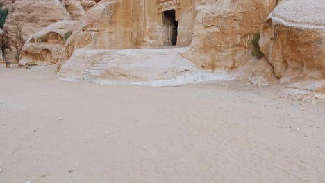 slow tilt up shot of petra rock cut architecture, jordan