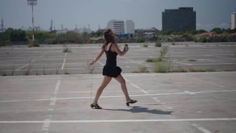woman walking in an empty parking lot