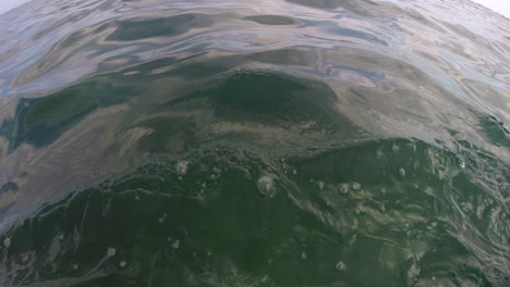 First-person-point-of-view,-man-swimming-in-ocean