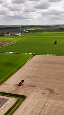 aerial view of dutch farmland and machinery