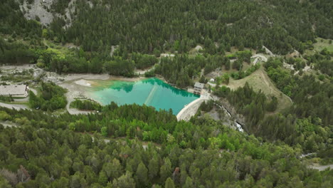 Romanche-valley-aerial-shot-over-fir-trees-on-a-mountain-french-alps-aerial