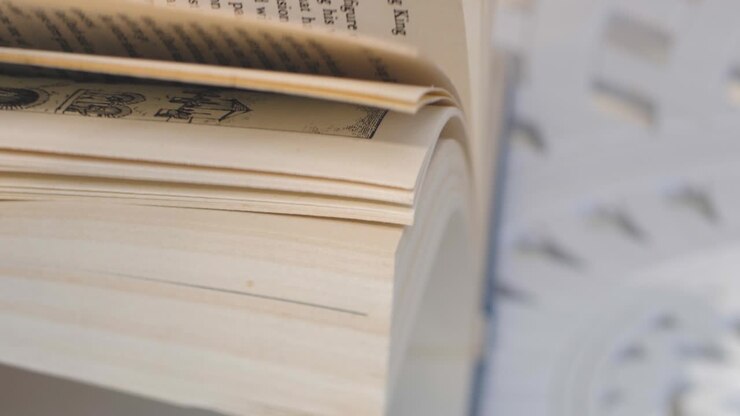 Woman's hands flipping through a book