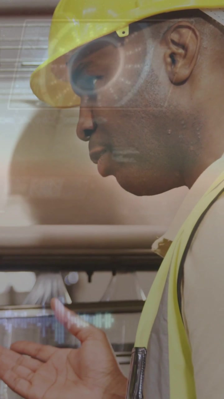 Vertical video: Plant technician leaning on pipe and gesturing, activating HUD readouts for checks