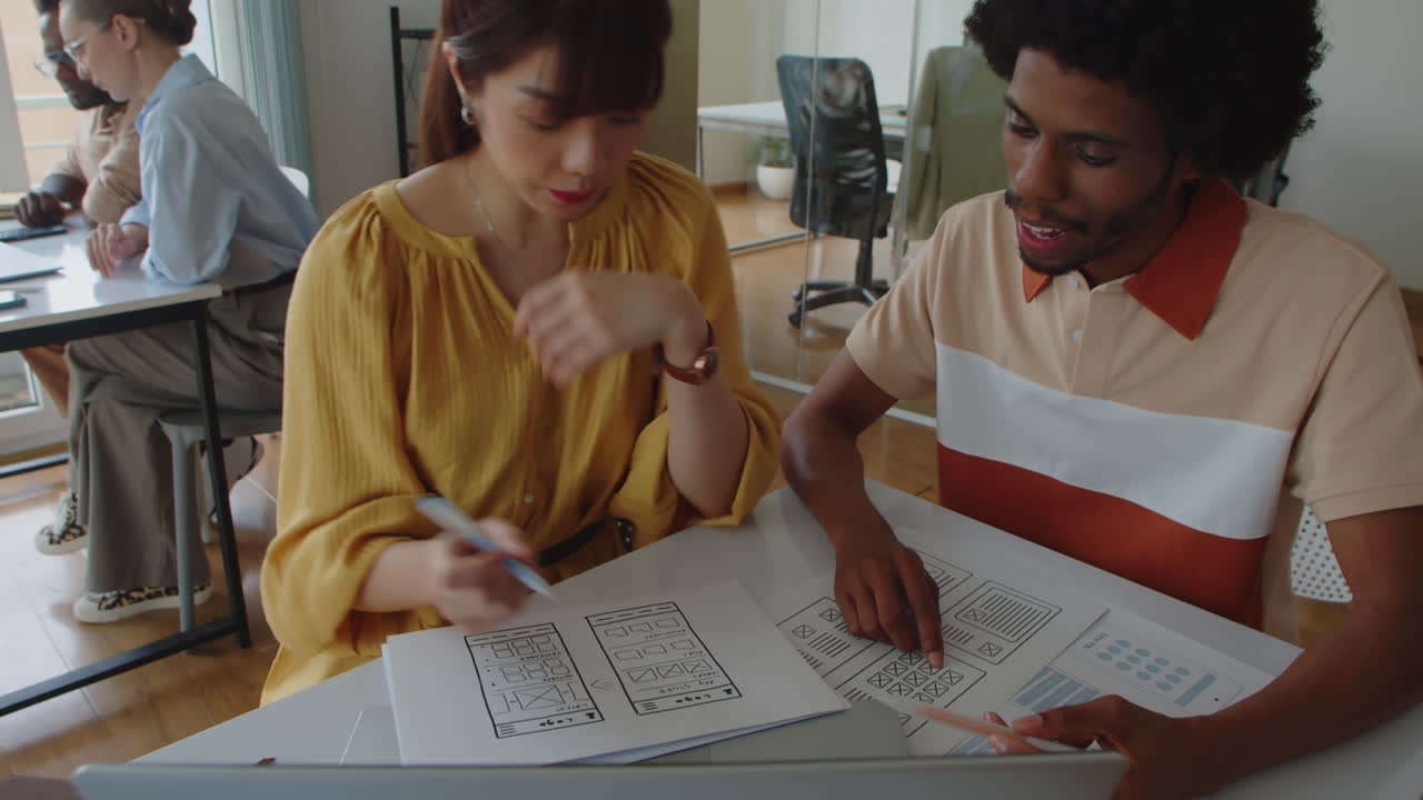 Young Startup Workers Developing App Interface