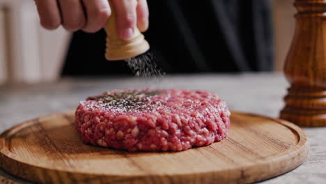 preparing a homemade beef burger