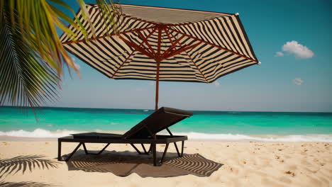 relaxing beach scene with striped umbrella and lounge chair