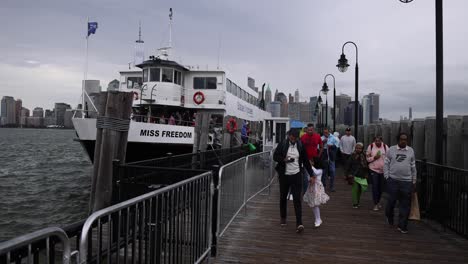 tourists disembarking from the miss freedom ship statue of liberty tour