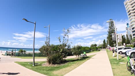 people walking along a coastal pathway