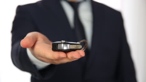 businessman show new car key