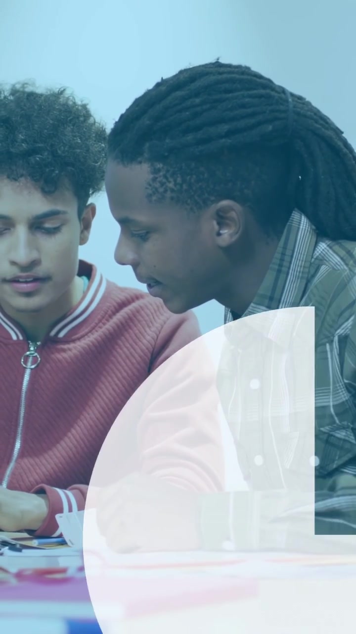 Vertical video: Two peers reviewing learning data at table, cloud icon popping, charts animating