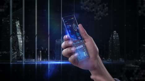 hand holding futuristic mobile phone against digitally generated background