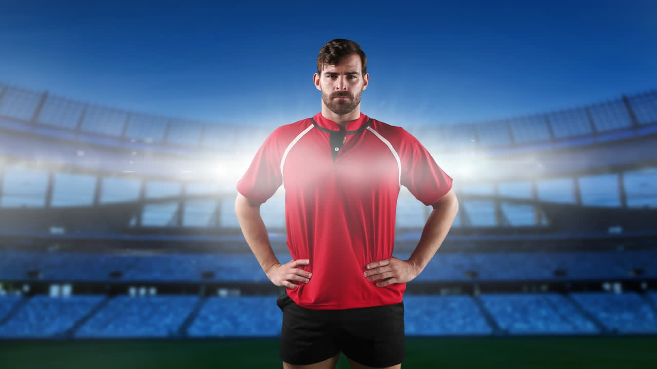 jugador de rugby profesional de pie frente a un estadio