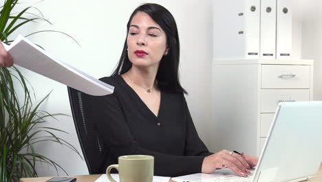 atractive female office worker receiving document