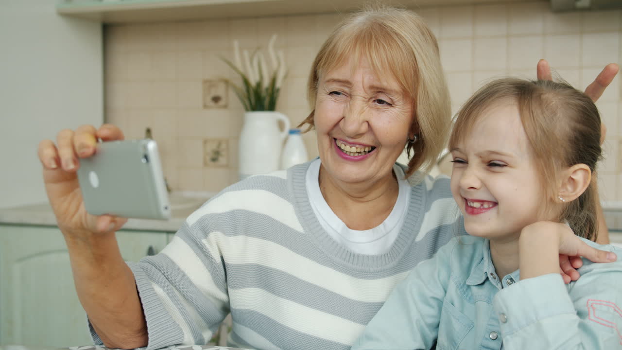 Grandmother and Granddaughter Taking Selfie