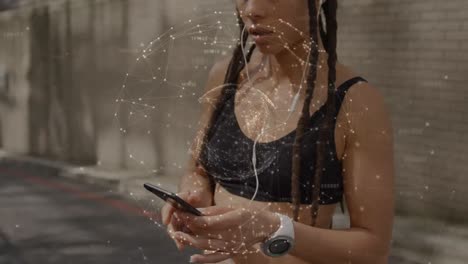 animation of network of connections over fit biracial woman using smartphone