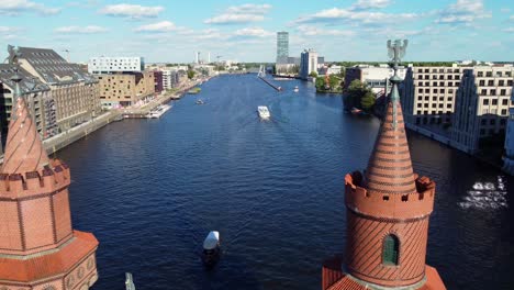 along the river over the bridge close to the tower