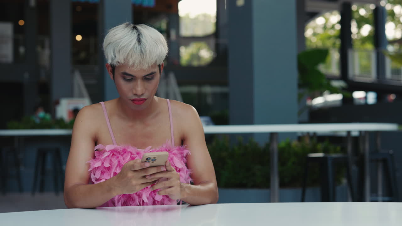 Person using a mobile phone in a cafe