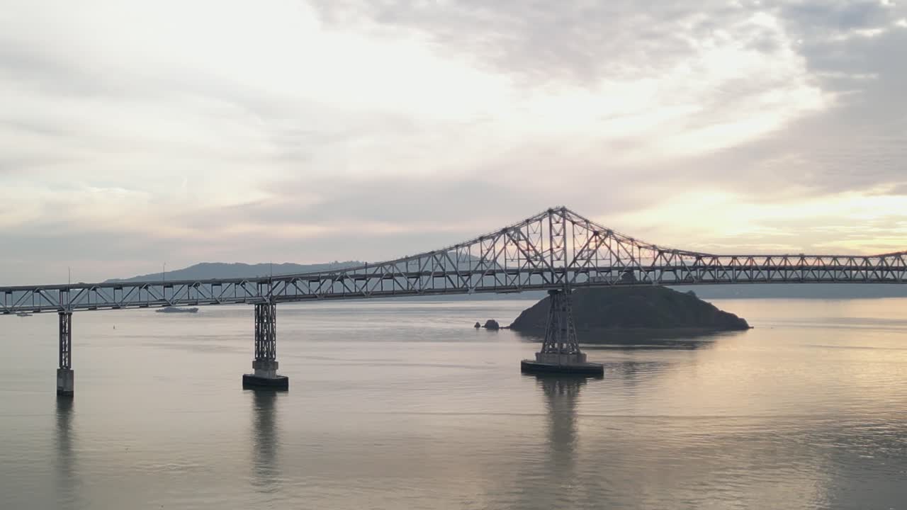 Medium aerial tracking left of Richmond Bridge from Point Molate Beach Richmond California USA