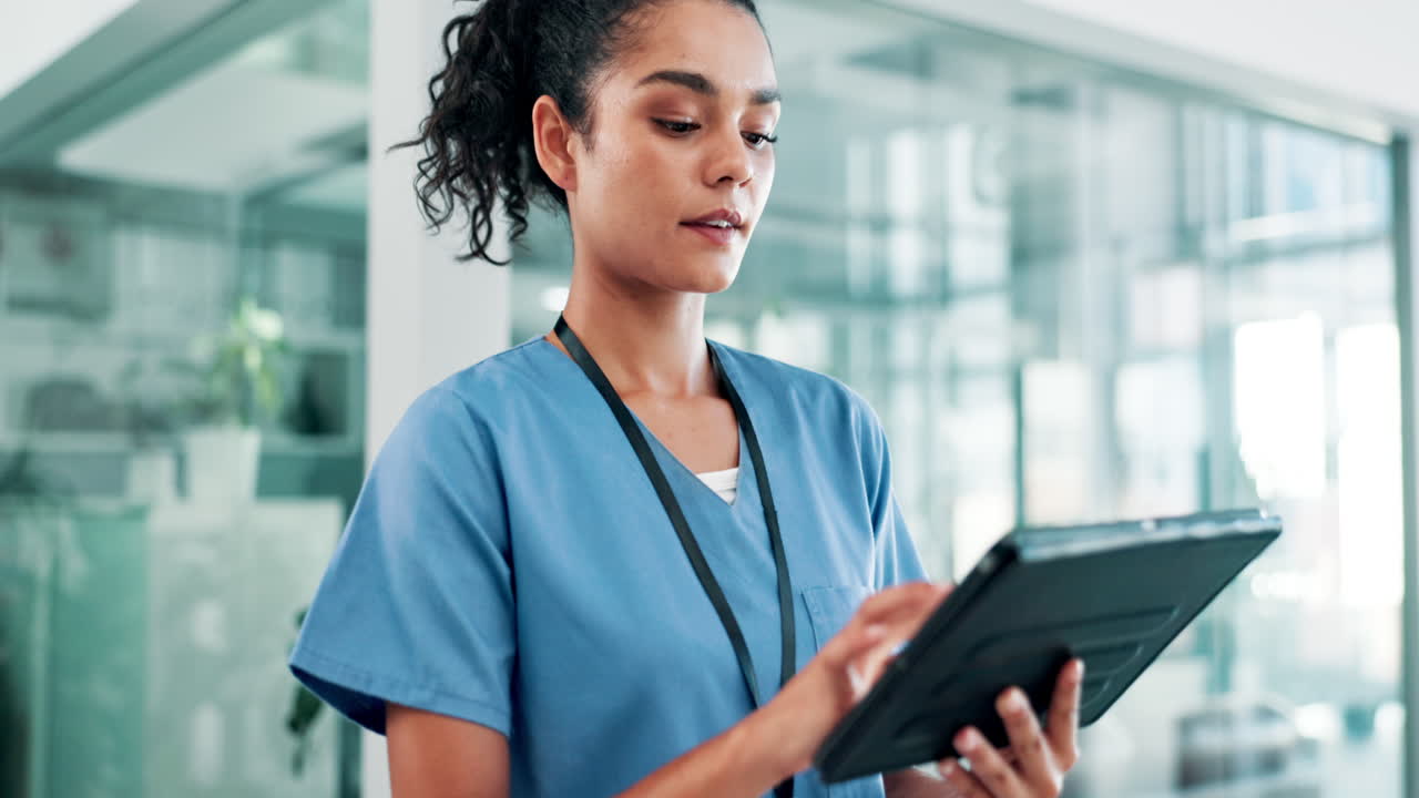 Nurse using tablet in hospital