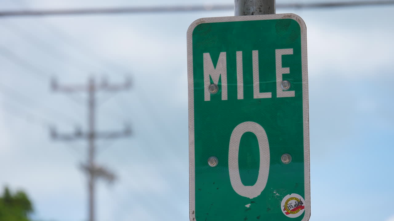 Slow motion shot of the Mile Marker Zero sign located at the end of Highway 1 in Key West FL