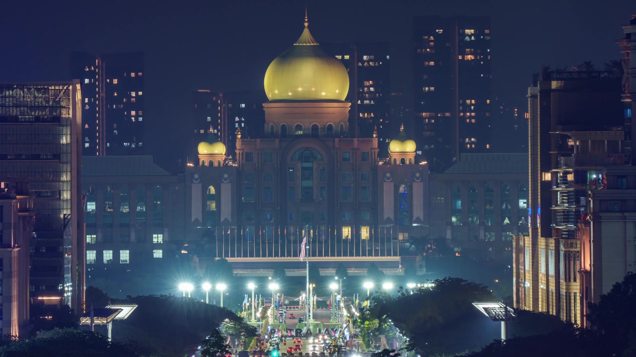 Illuminated green dome of Perdana Putra Prime Minister Office at Dataran Putra at night time lapse
