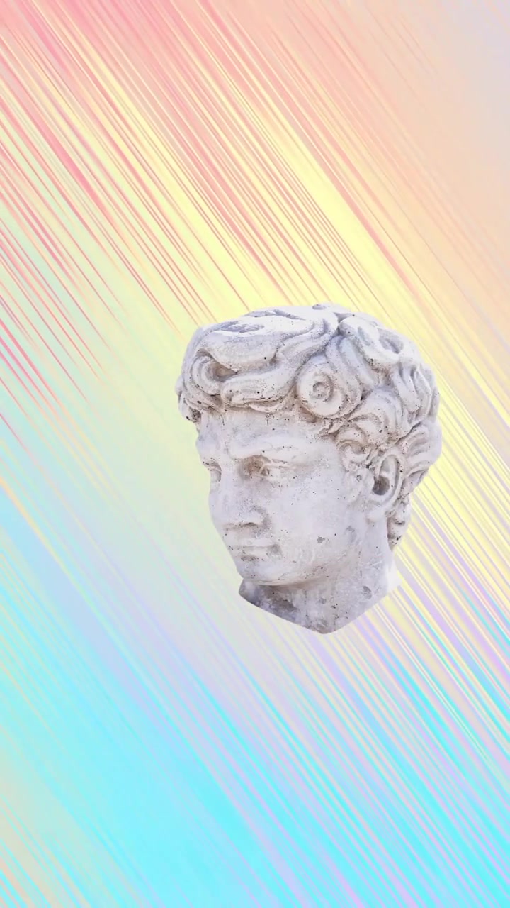 Animazione di teste di sculture antiche che si muovono su sfondo multicolore.