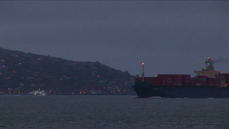 a container ship moves slowly through san francisco bay