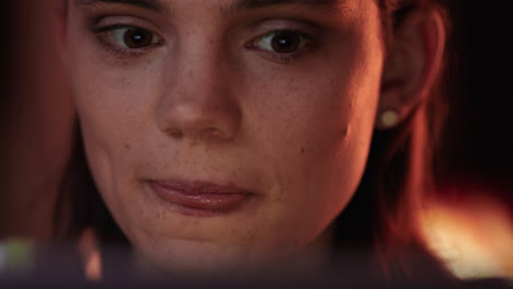 close-up-portrait-happy-woman-using-tablet-computer-watching-movie-at-night-drinking-wine-enjoying-entertainment