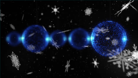 animation of blue christmas balls over snow falling on dark background