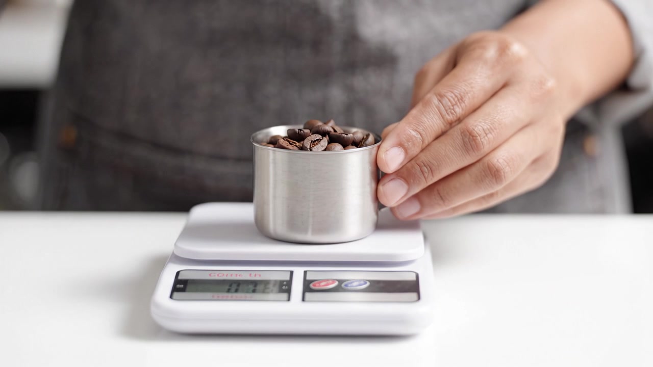 Measuring Ingredients with Precision: A Step-by-Step Process of Weighing Coffee Beans Using a Digital Scale for Perfect Brewing Each Time
