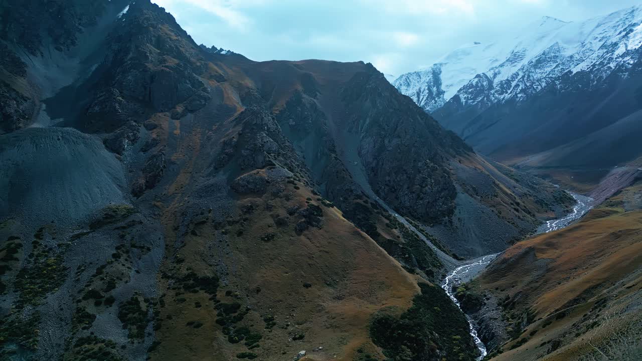 Cinematic aerial view, serene nature scenery, mountainous valley pass