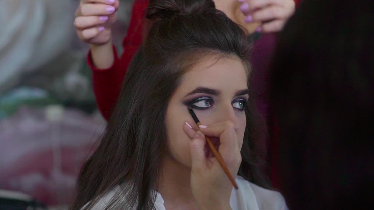 Woman getting her makeup done