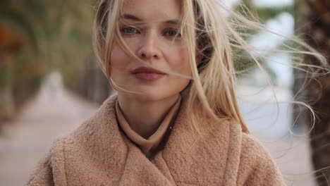 young woman looking at the camera outdoors.