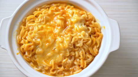 spicy instant noodle bowl with mozzarella cheese