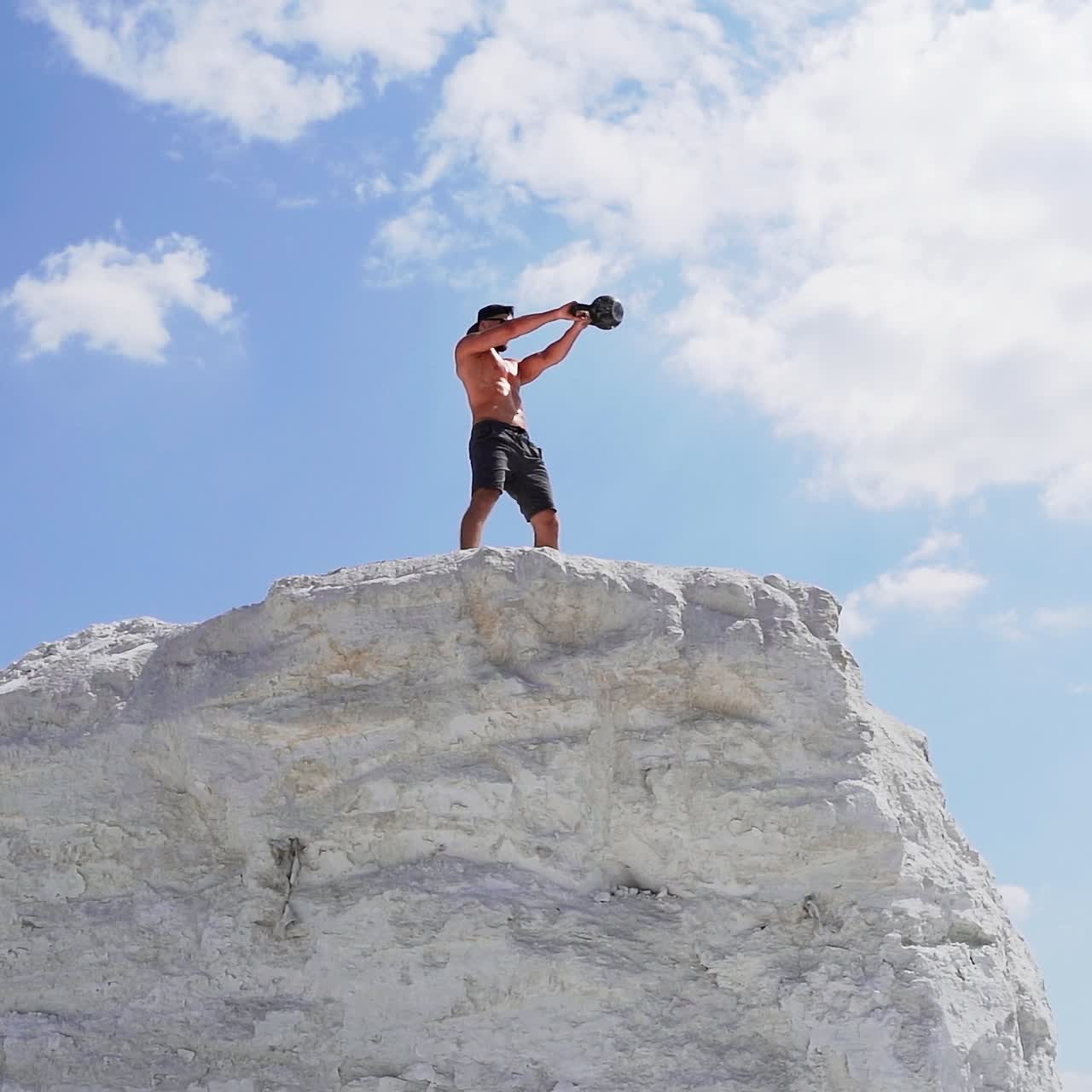 Sportive man with dumbbell