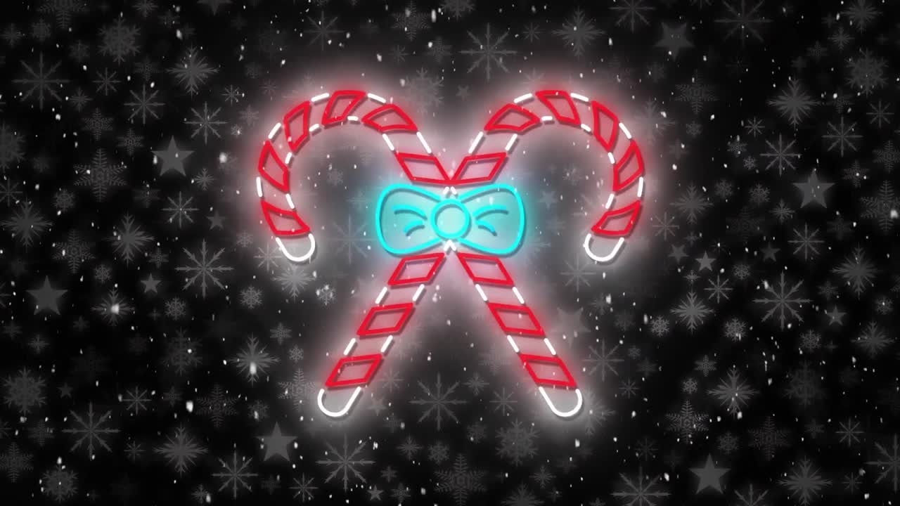 animación de bastones de caramelo en navidad sobre la nieve que cae