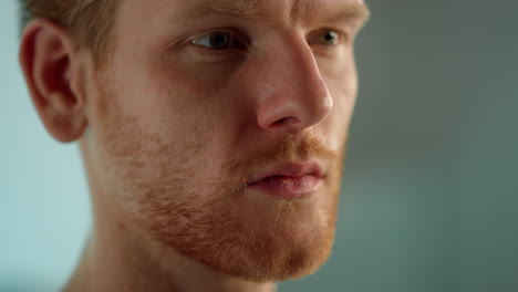 Ginger-businessman-looking-distance-closeup.-Man-studying-document-thoughtfully