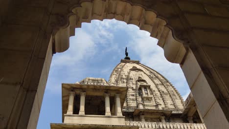stunning upward view of kirti mandir dome framed by arched stone entry, highlighting indian heritage in vadodara.