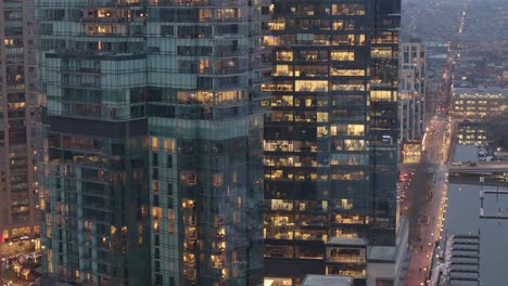 Aerial-pan-shot-of-Tall-Buildings-around-the-inner-harbor-in-a-Bright-City,-Baltimore,-Maryland