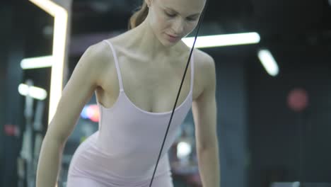 woman working out on a cable machine in gym