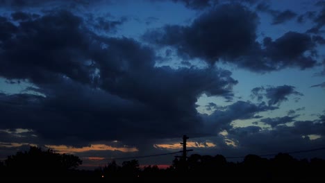 cloudy sunset giving way to night in the vietnamese island of cat ba with light poles below, timelapse shot