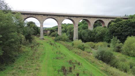 lowering drone shot of newton cap viaduct over river wear. bishop auckland, county durham - uk