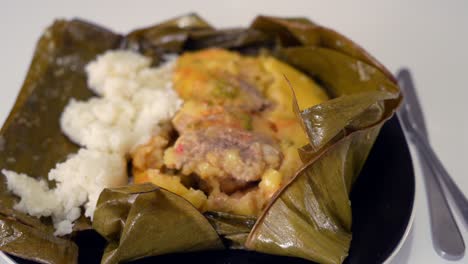 colombian food tamal with rice close up view isolated