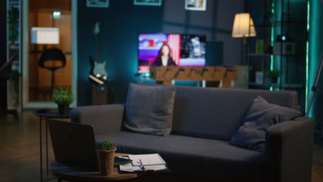 modern apartment loft with a cozy corner and trendy decorations, comfy space decorated with electronics and a coffee table in the living room. empty studio with minimalist furniture, chill lifestyle.