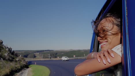 young woman on a road trip in pick-up truck