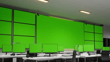 modern control room with green screen monitors