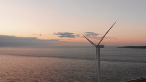 windturbines during sunset on the island neeltje jans, the netherlands