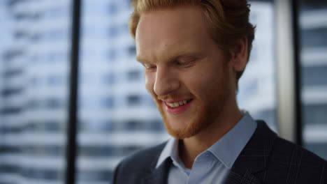 Businessman-looking-tablet.-Male-professional-working-near-office-window