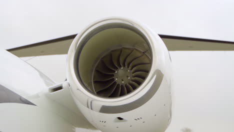 medium shot of jet engine on a small private jet named cessna citation during daytime